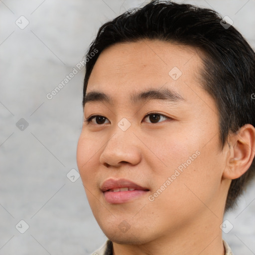 Joyful asian young-adult male with short  black hair and brown eyes