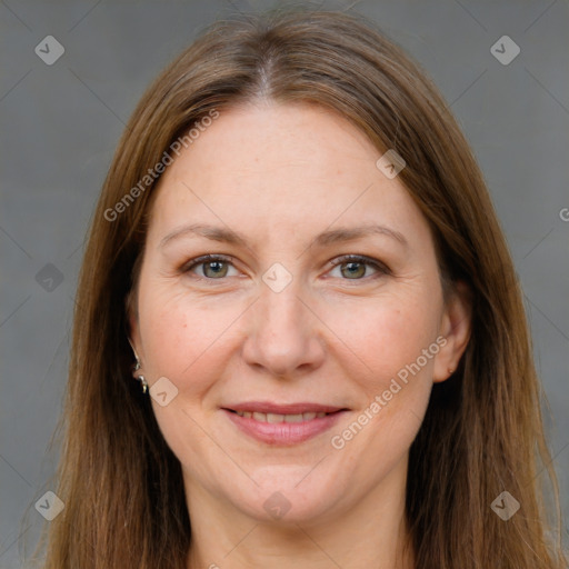 Joyful white adult female with long  brown hair and brown eyes