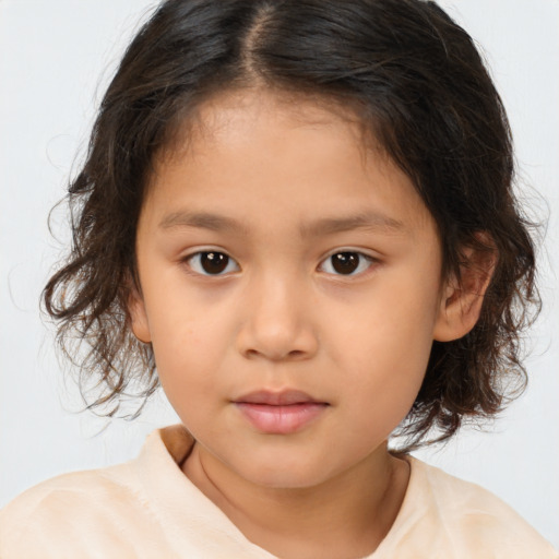 Joyful asian child female with medium  brown hair and brown eyes