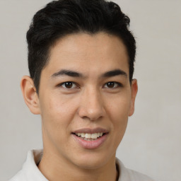 Joyful latino young-adult male with short  brown hair and brown eyes