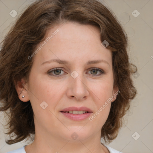 Joyful white young-adult female with medium  brown hair and green eyes