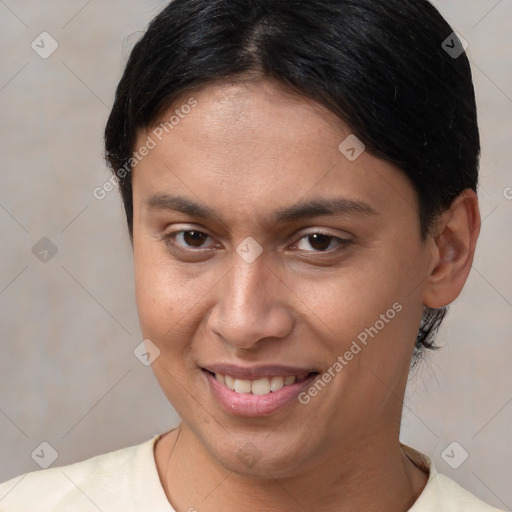 Joyful white young-adult female with short  brown hair and brown eyes