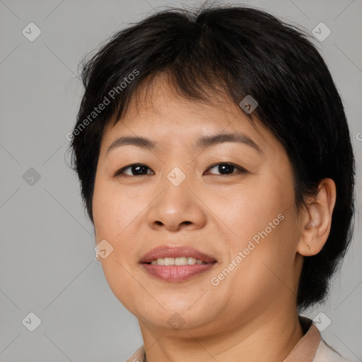 Joyful asian adult female with medium  brown hair and brown eyes