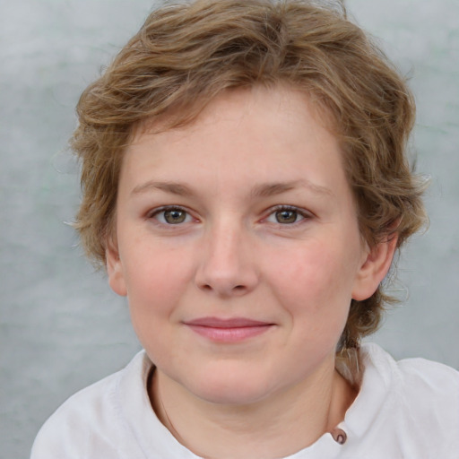 Joyful white young-adult female with medium  brown hair and blue eyes