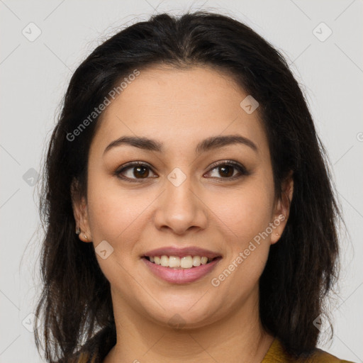 Joyful latino young-adult female with long  brown hair and brown eyes