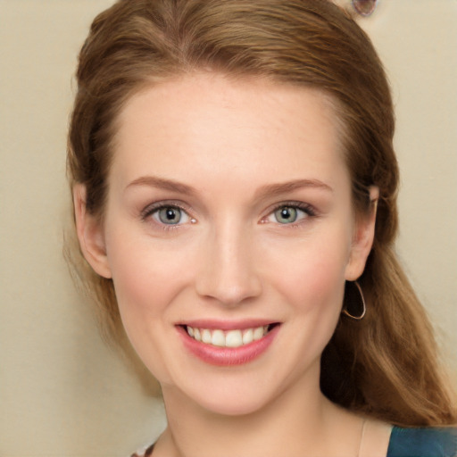 Joyful white young-adult female with long  brown hair and grey eyes