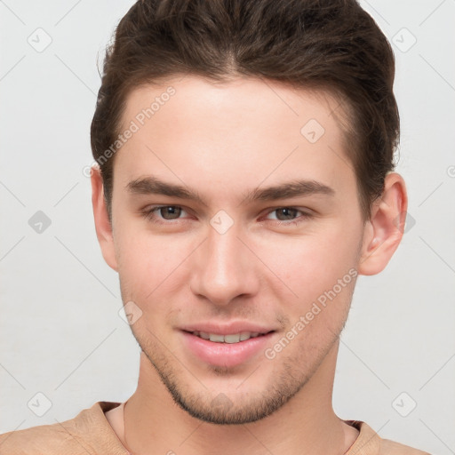 Joyful white young-adult male with short  brown hair and brown eyes