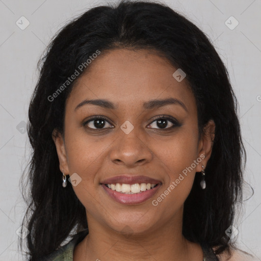 Joyful black young-adult female with long  brown hair and brown eyes