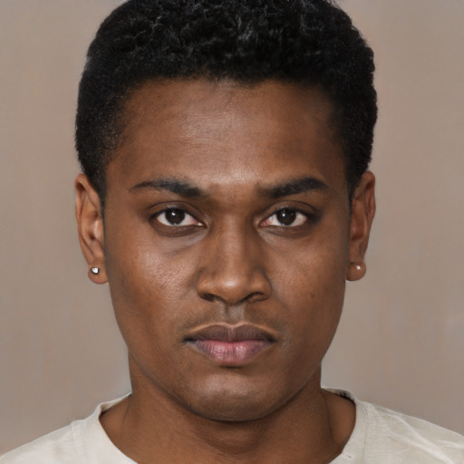 Neutral black young-adult male with short  black hair and brown eyes