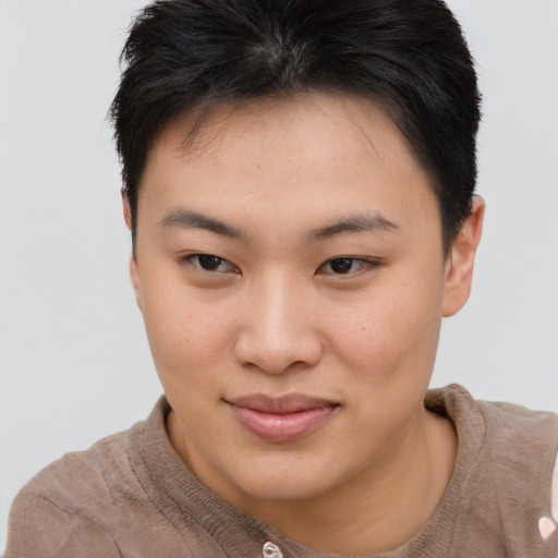 Joyful asian young-adult female with short  brown hair and brown eyes
