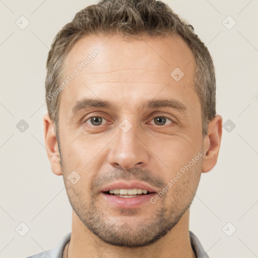 Joyful white adult male with short  brown hair and brown eyes