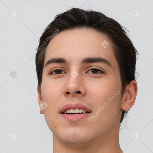 Joyful white young-adult male with short  brown hair and brown eyes