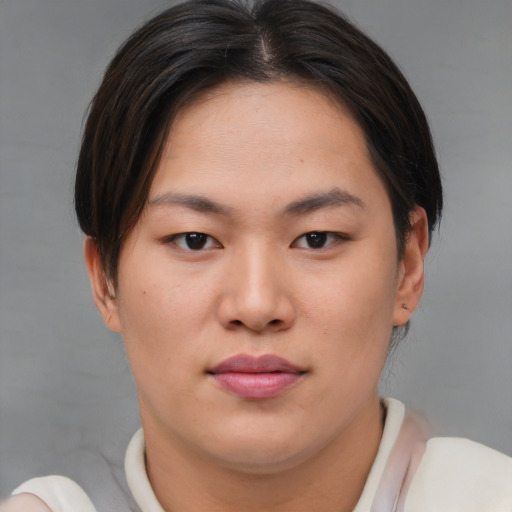 Joyful asian young-adult female with short  brown hair and brown eyes