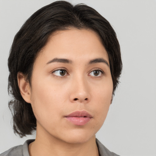 Neutral asian young-adult female with medium  brown hair and brown eyes