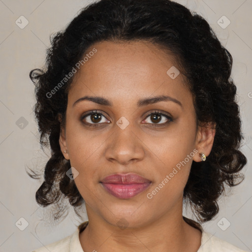 Joyful black adult female with medium  brown hair and brown eyes