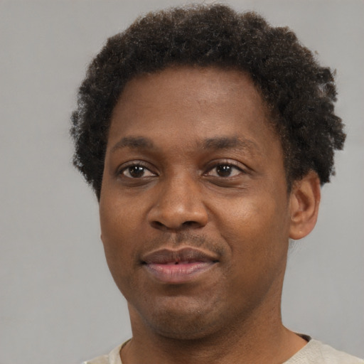 Neutral black young-adult male with short  brown hair and brown eyes