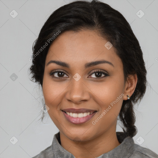 Joyful latino young-adult female with medium  brown hair and brown eyes