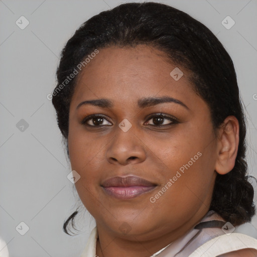 Joyful black young-adult female with medium  black hair and brown eyes