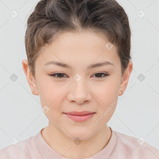 Joyful white child female with short  brown hair and brown eyes