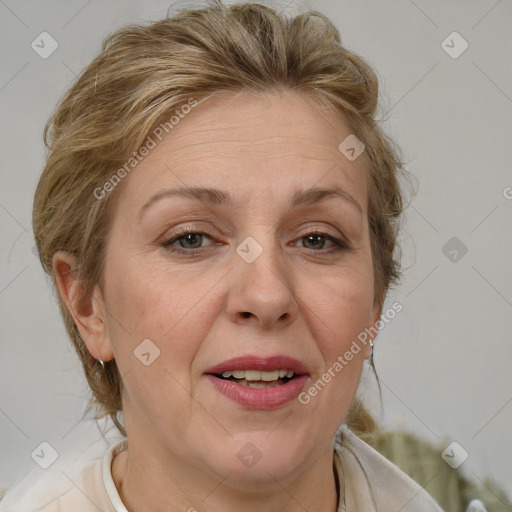 Joyful white adult female with medium  brown hair and blue eyes