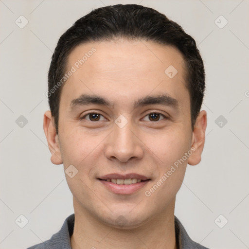 Joyful white young-adult male with short  black hair and brown eyes