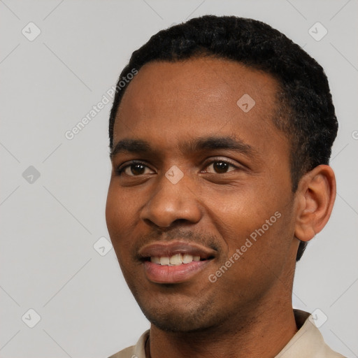 Joyful black young-adult male with short  black hair and brown eyes