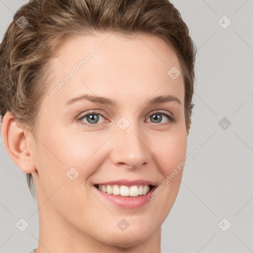 Joyful white young-adult female with short  brown hair and grey eyes