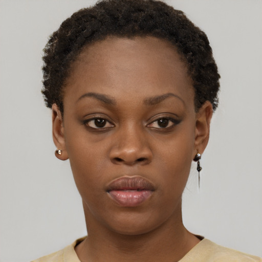 Neutral black young-adult female with short  brown hair and brown eyes