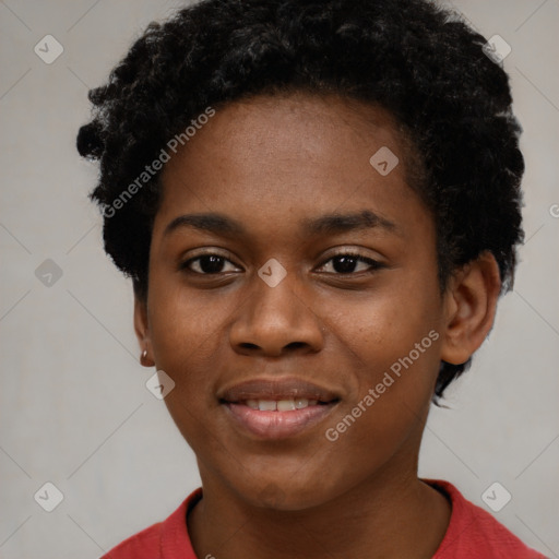 Joyful black young-adult female with short  black hair and brown eyes