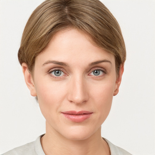 Joyful white young-adult female with short  brown hair and grey eyes