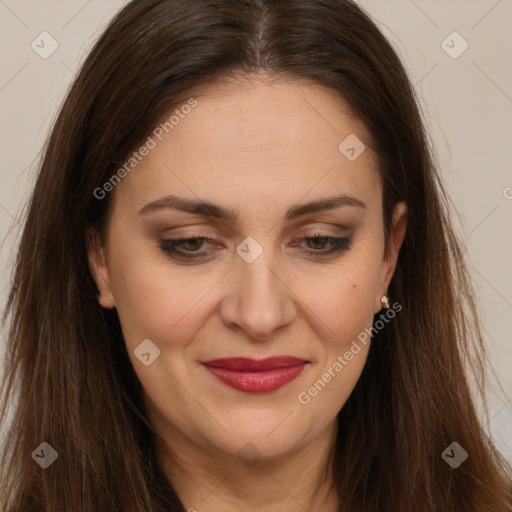 Joyful white adult female with long  brown hair and brown eyes