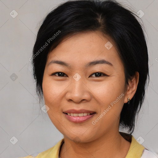 Joyful asian young-adult female with medium  black hair and brown eyes