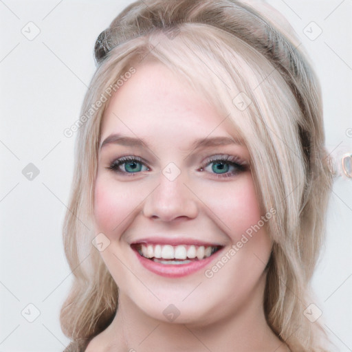 Joyful white young-adult female with long  brown hair and blue eyes