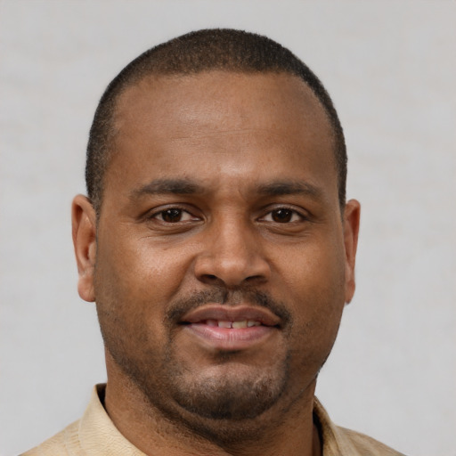 Neutral latino young-adult male with short  brown hair and brown eyes