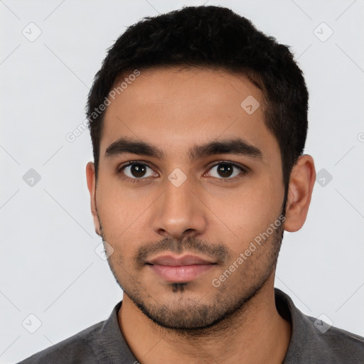 Neutral latino young-adult male with short  black hair and brown eyes