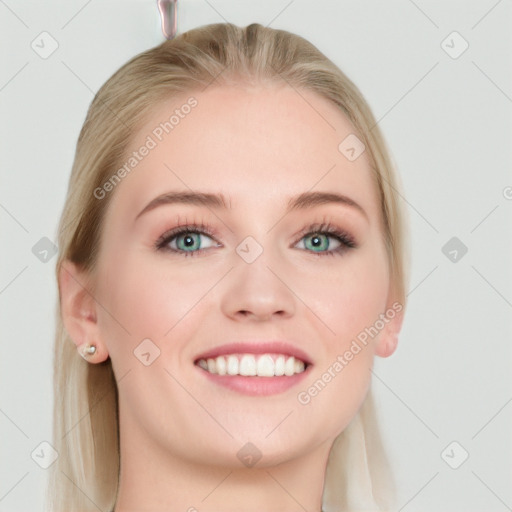 Joyful white young-adult female with long  brown hair and blue eyes