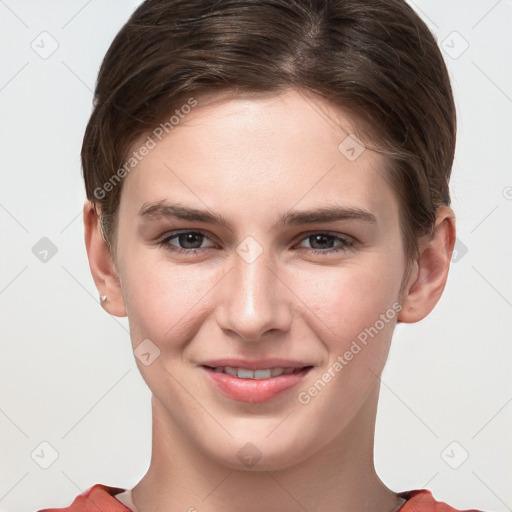 Joyful white young-adult female with short  brown hair and grey eyes