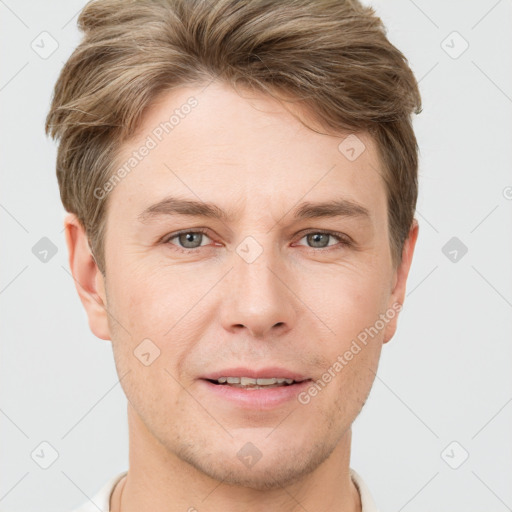 Joyful white adult male with short  brown hair and grey eyes