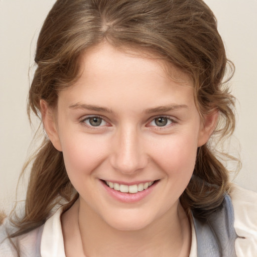 Joyful white child female with medium  brown hair and brown eyes