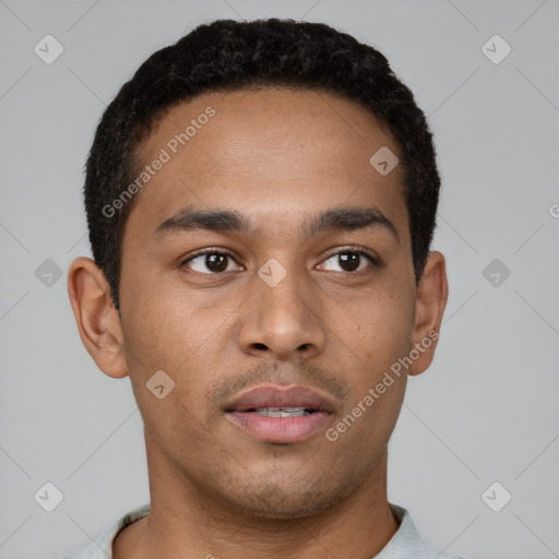 Neutral latino young-adult male with short  black hair and brown eyes