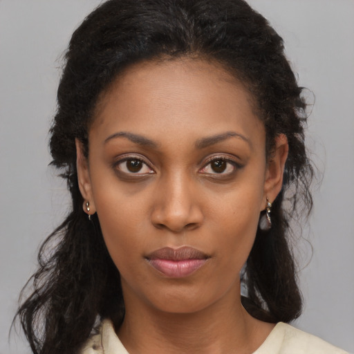 Neutral black young-adult female with long  brown hair and brown eyes