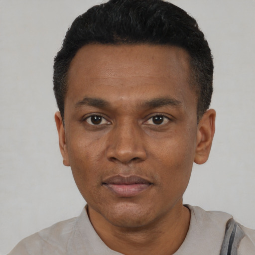 Neutral black young-adult male with short  black hair and brown eyes