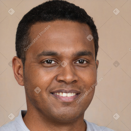 Joyful latino young-adult male with short  brown hair and brown eyes