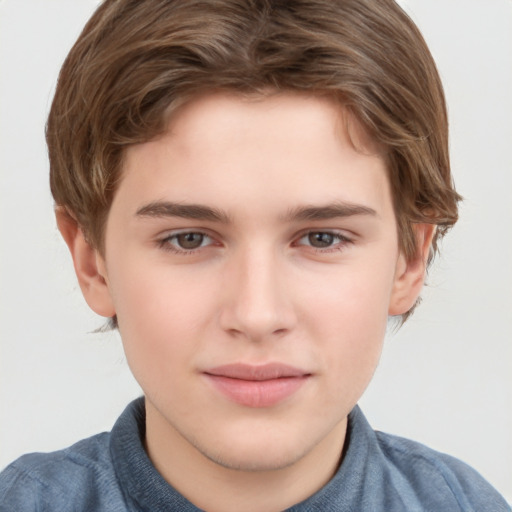 Joyful white child male with short  brown hair and brown eyes