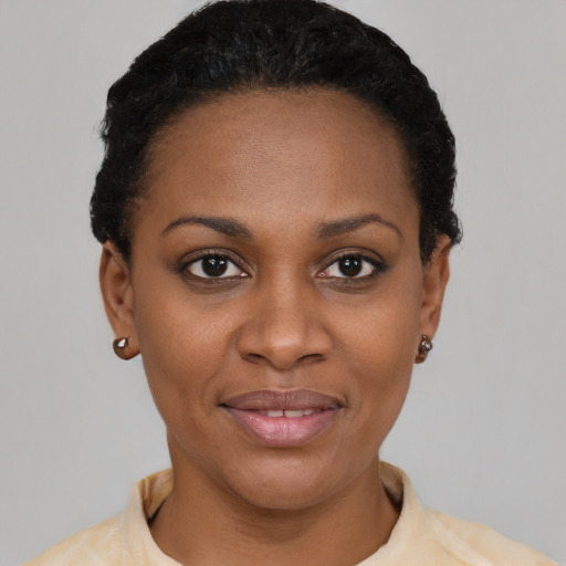 Joyful latino young-adult female with short  black hair and brown eyes