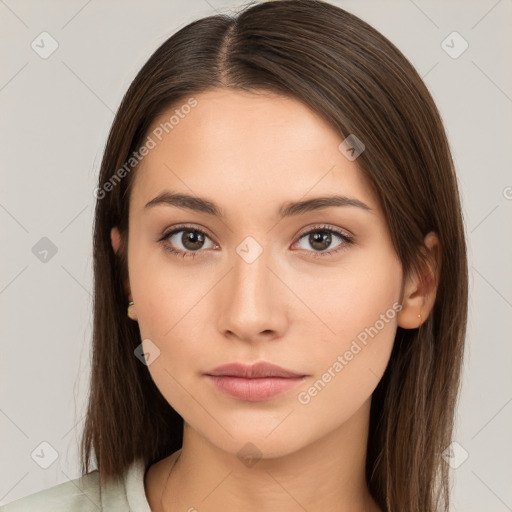 Neutral white young-adult female with long  brown hair and brown eyes