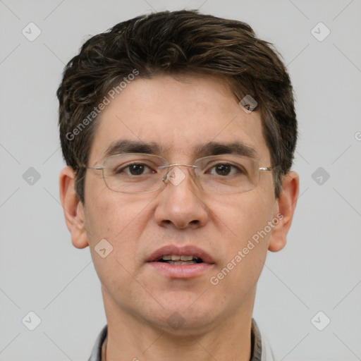 Joyful white adult male with short  brown hair and grey eyes