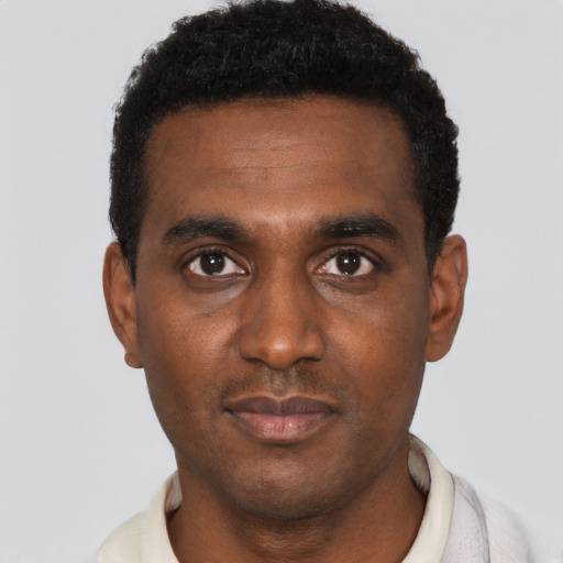 Neutral black young-adult male with short  black hair and brown eyes