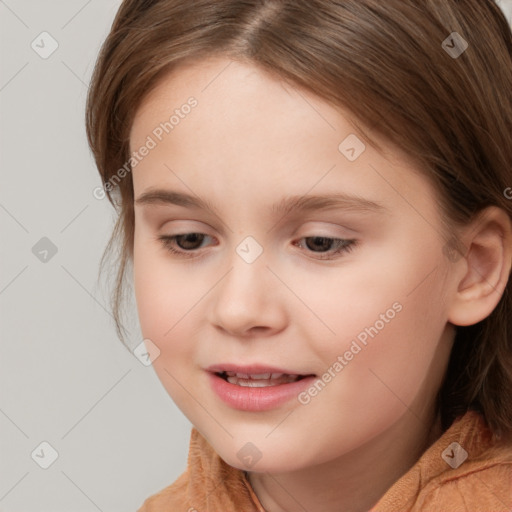 Joyful white child female with medium  brown hair and brown eyes