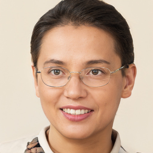 Joyful white adult female with short  brown hair and brown eyes